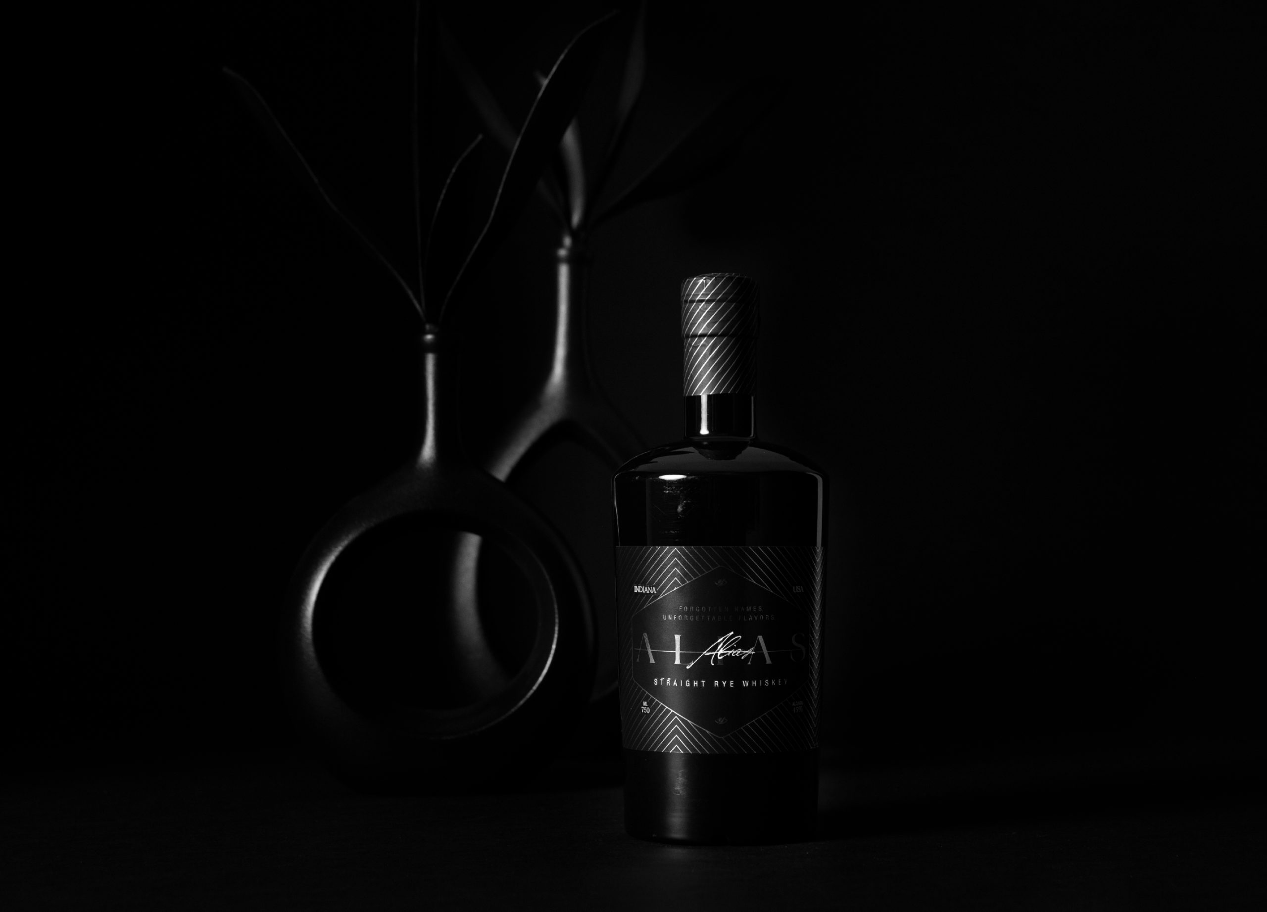 Alias Bottle with Black Vases