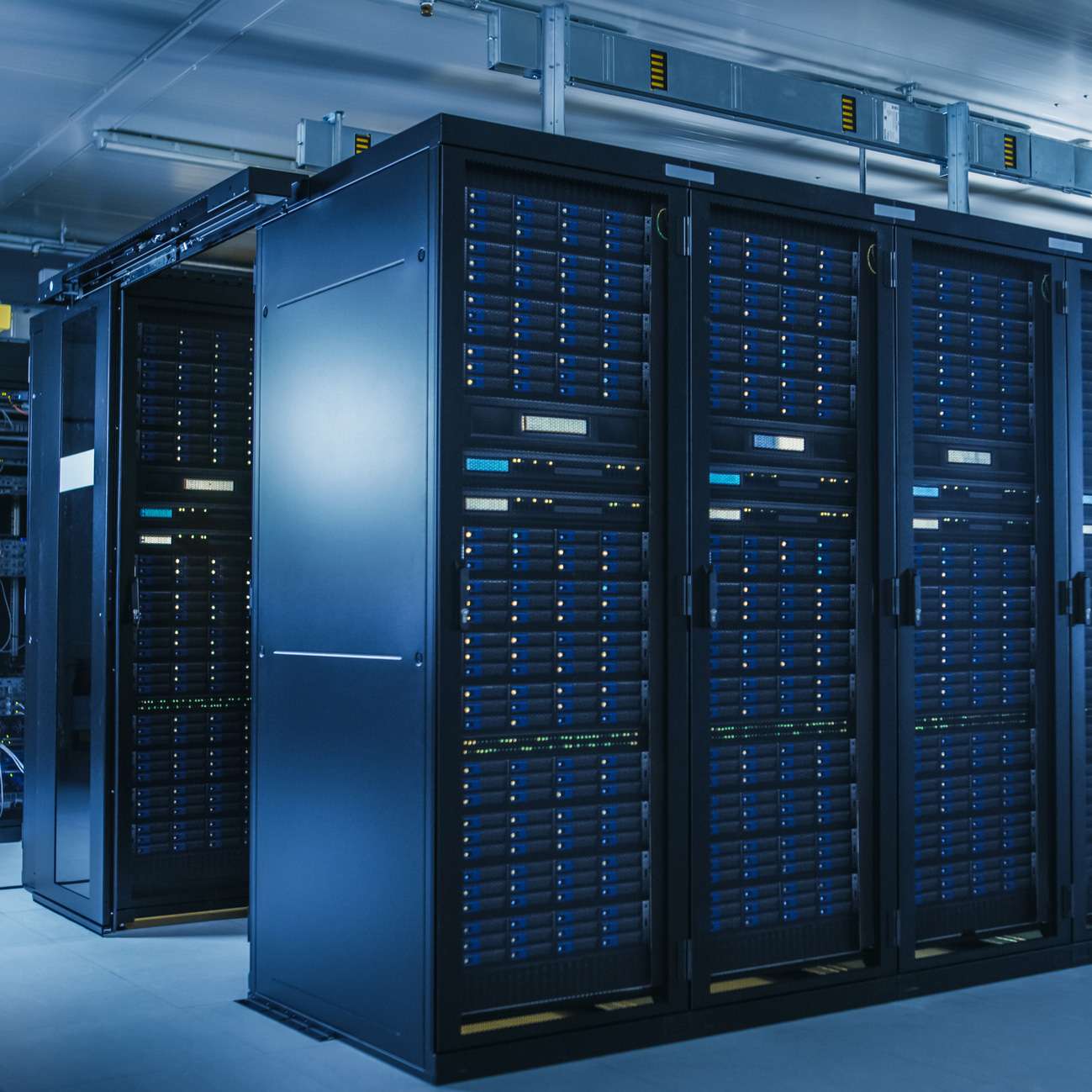Multiple Rows of Operational Server Racks in a modern data center