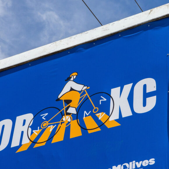 Close up of billboard illustration of biker in crosswalk