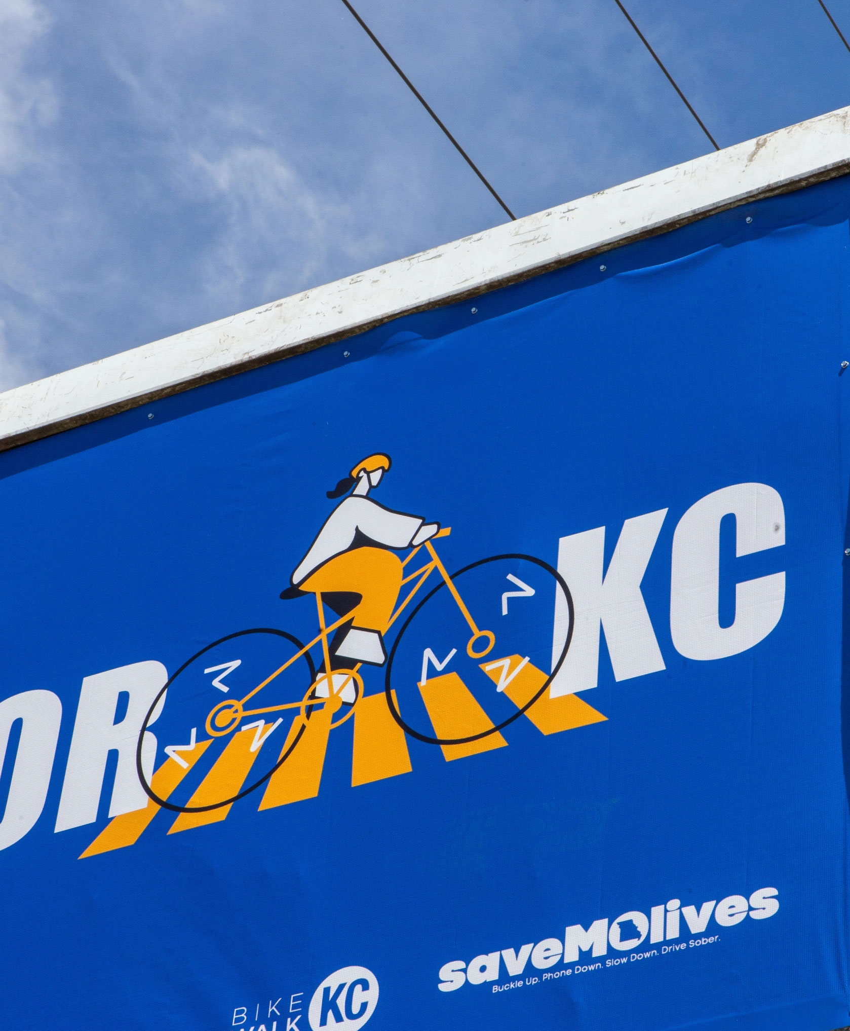 Close up of billboard illustration of biker in crosswalk