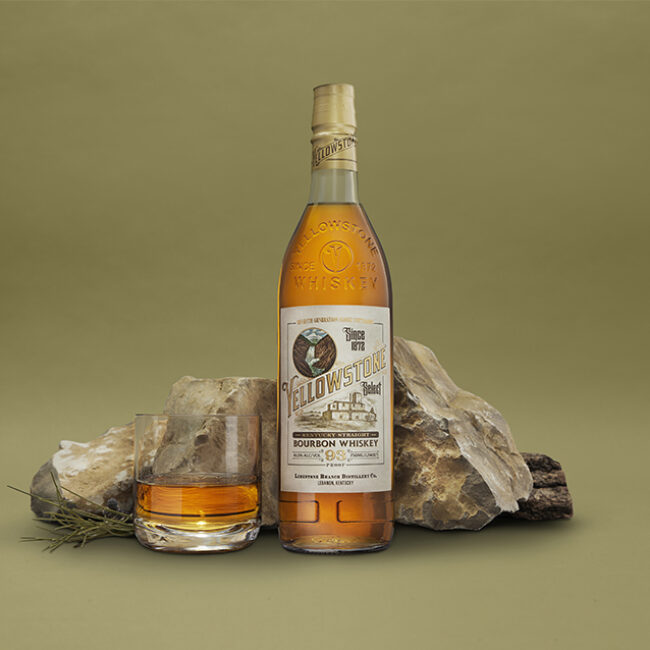 Yellowstone Bourbon Whiskey bottle and cocktail glass