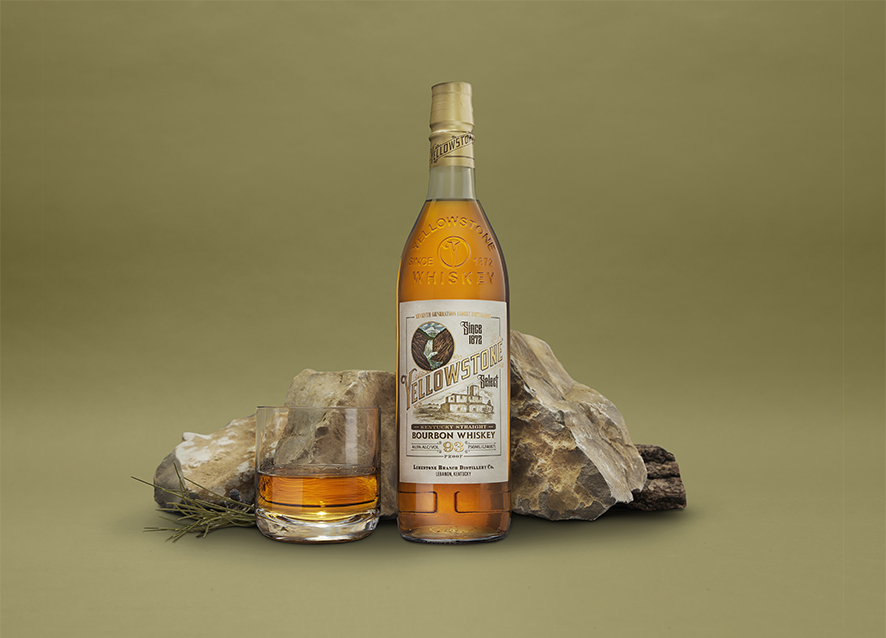 Yellowstone Bourbon Whiskey bottle and cocktail glass