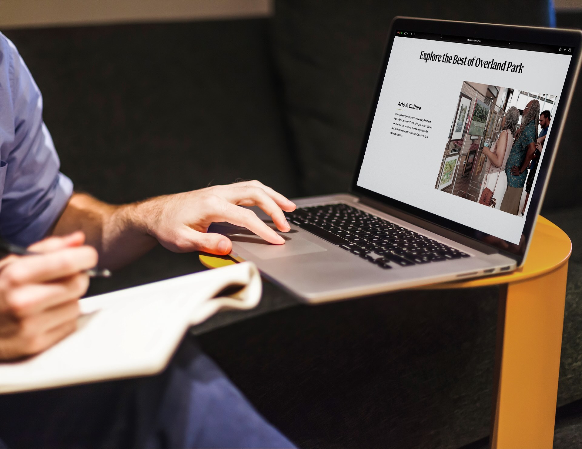 Hands resting on laptop open to allinoverlandpark.com